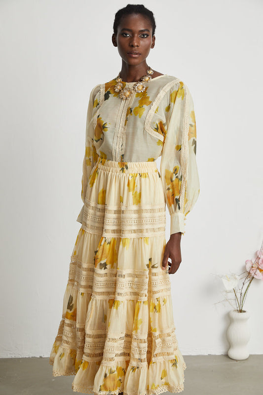 Elegant yellow blouse and skirt set with a delicate floral print