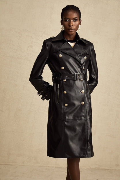 black doublebreasted leather coat with a belt cinched at the waist