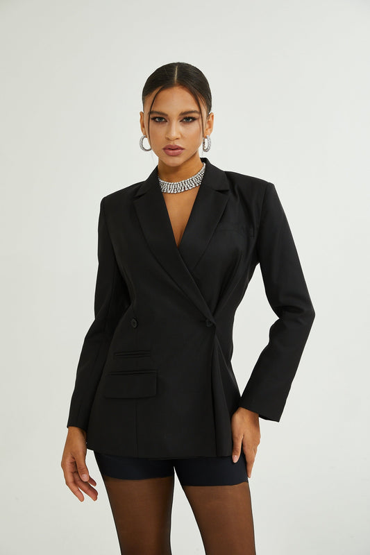 A black doublebreasted wool blazer with a tailored silhouette featuring long sleeves and lapels