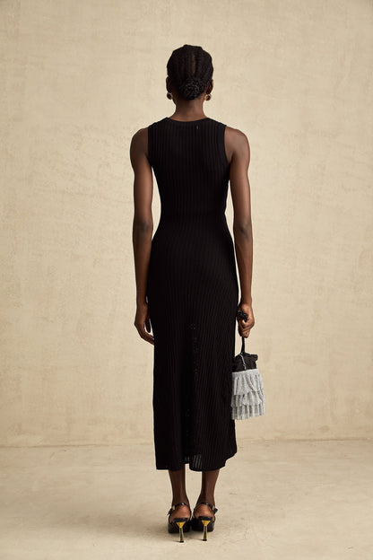 A black knitted midi dress with hoop embellishments