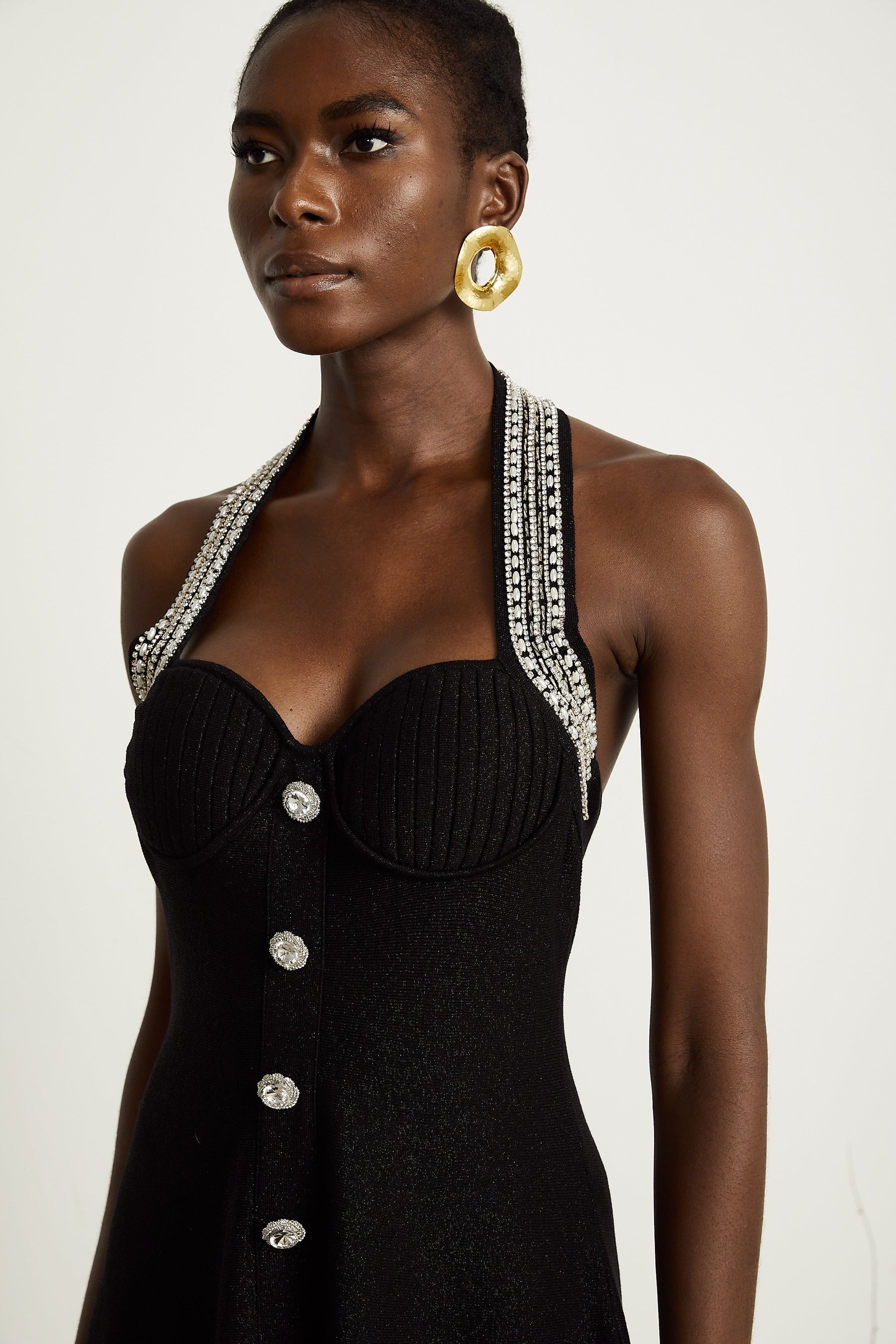 A black knitted mini dress with embellishments