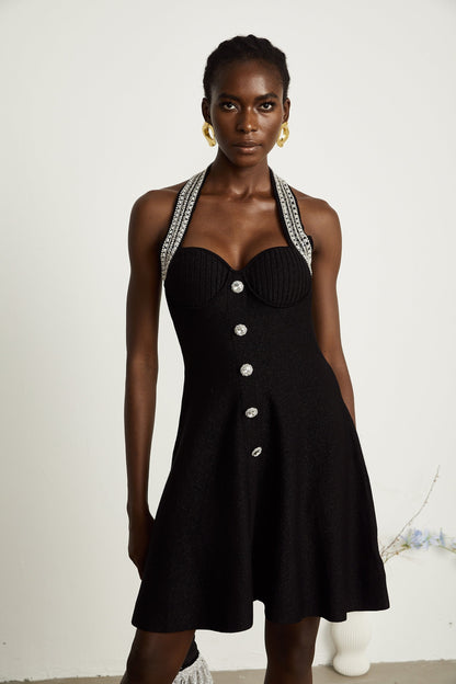 A black knitted mini dress with embellishments