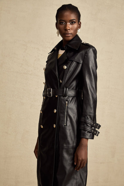 black doublebreasted leather coat with a belt cinched at the waist