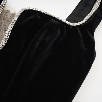 A black midi dress with a Ushaped neckline