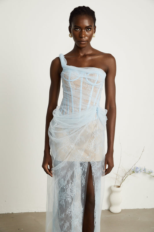 A blue pleated midi dress with mesh fabric featuring a flowing silhouette and delicate texture