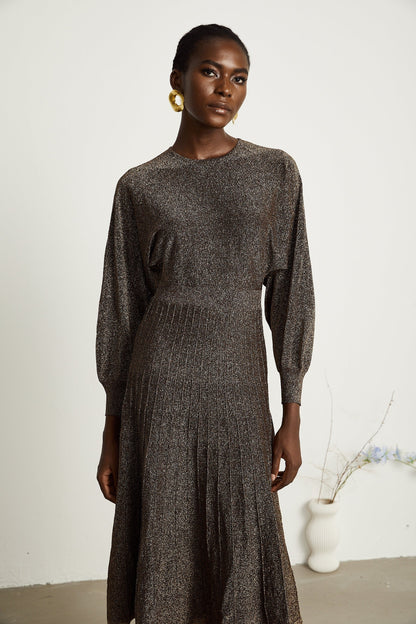 A brown ribbed midi dress with metallic threading and a fitted silhouette