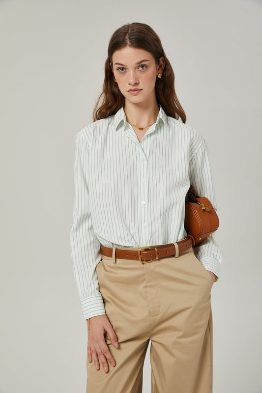 A casual striped shirt with a relaxed fit featuring vertical stripes in contrasting colors on a light background