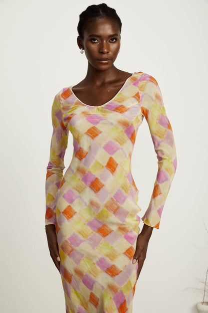 A flared midi dress with a colorblock design featuring a check pattern in various shades of Grace