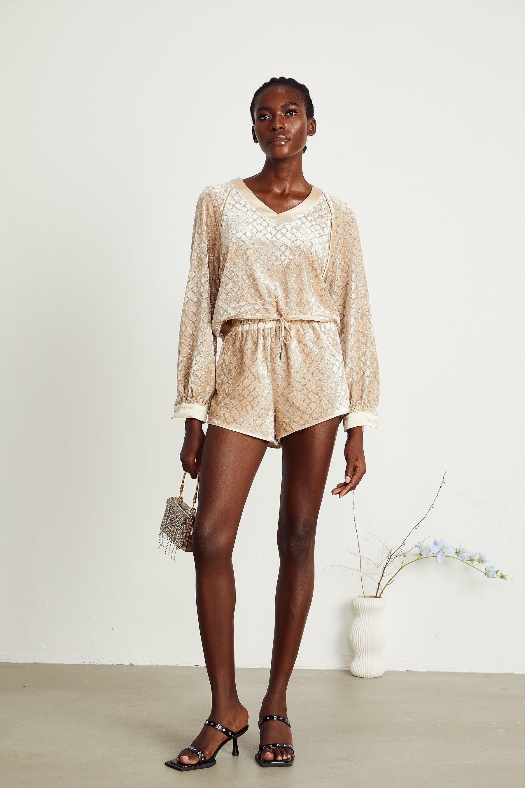 A matching set featuring a velvet top and shorts adorned with rhinestones in a Pascale design