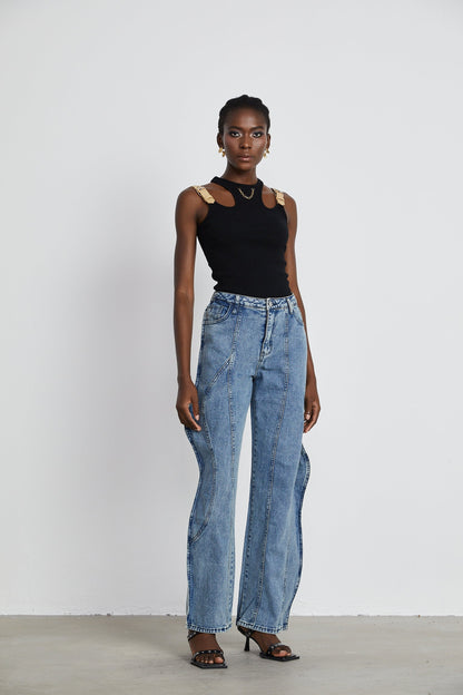 A pair of asymmetric wide leg jeans with one leg wider than the other called Brigitte