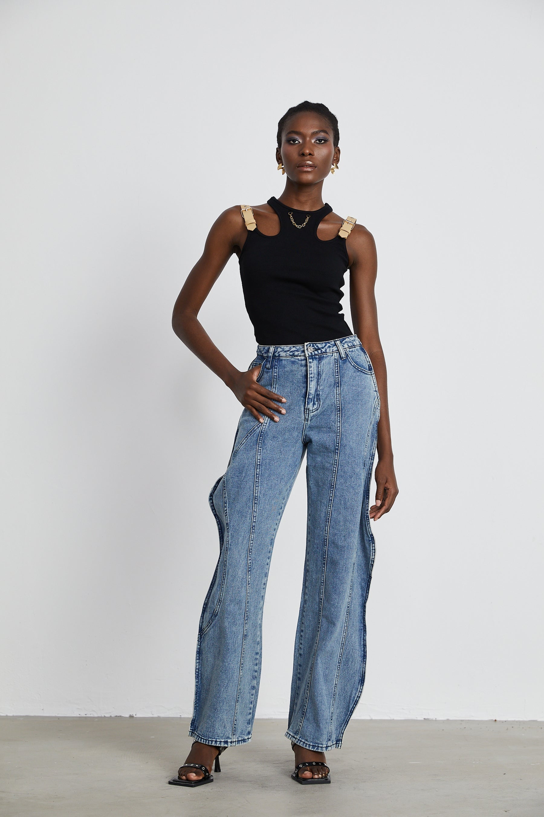 A pair of asymmetric wideleg jeans called Brigitte featuring an uneven hemline and relaxed fit