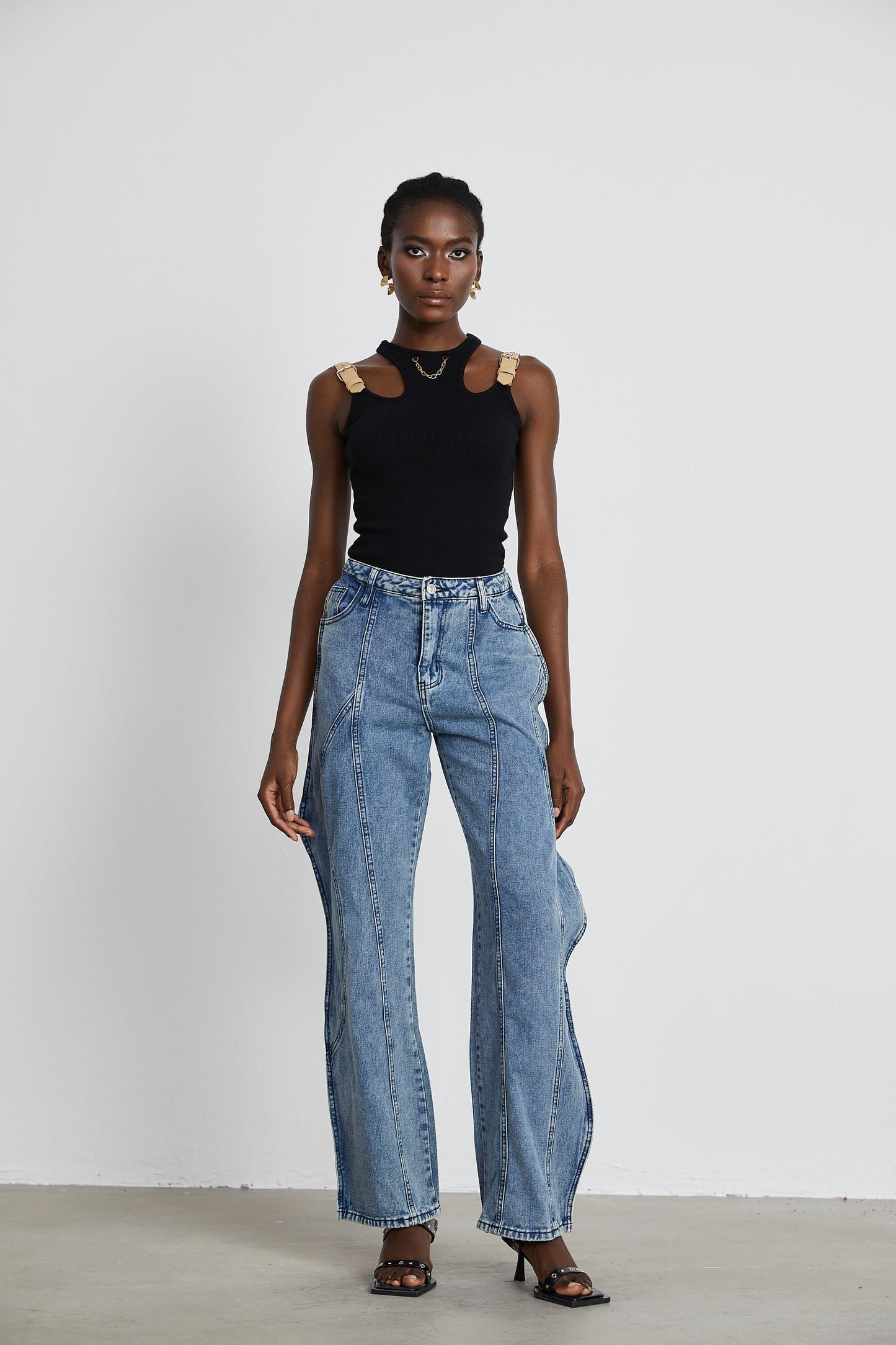 A pair of asymmetric wideleg jeans named Brigitte featuring an uneven hemline and relaxed fit