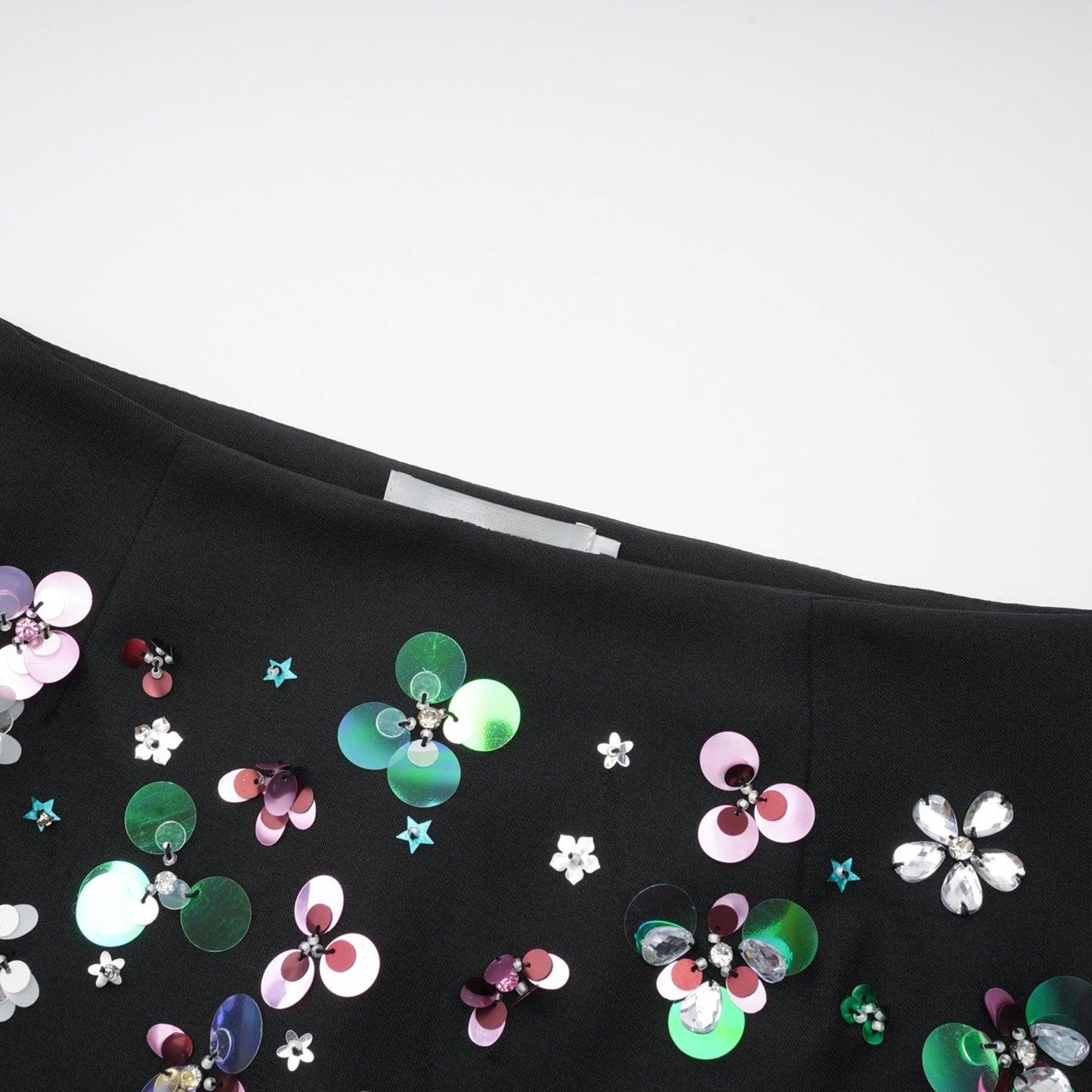 A pair of black shorts with embellished details named Roseline