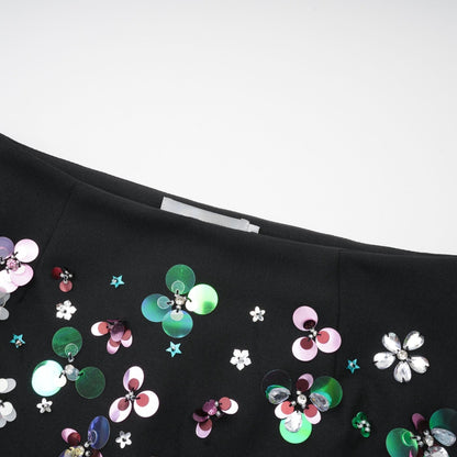 A pair of black shorts with embellished details named Roseline