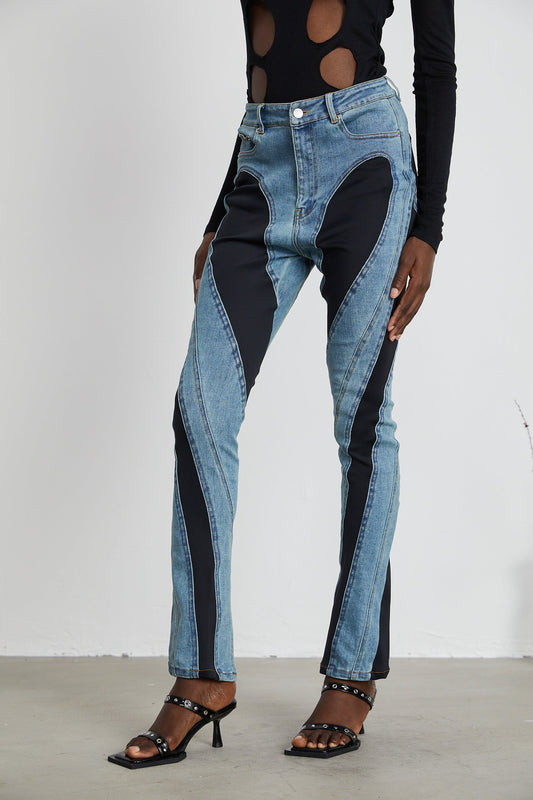 A pair of spiral panelled skinny jeans from Noémie featuring a unique spiral design on the legs