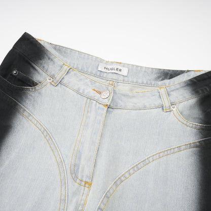 A pair of wideleg jeans featuring a twotone design with contrasting light and dark denim sections called Giada