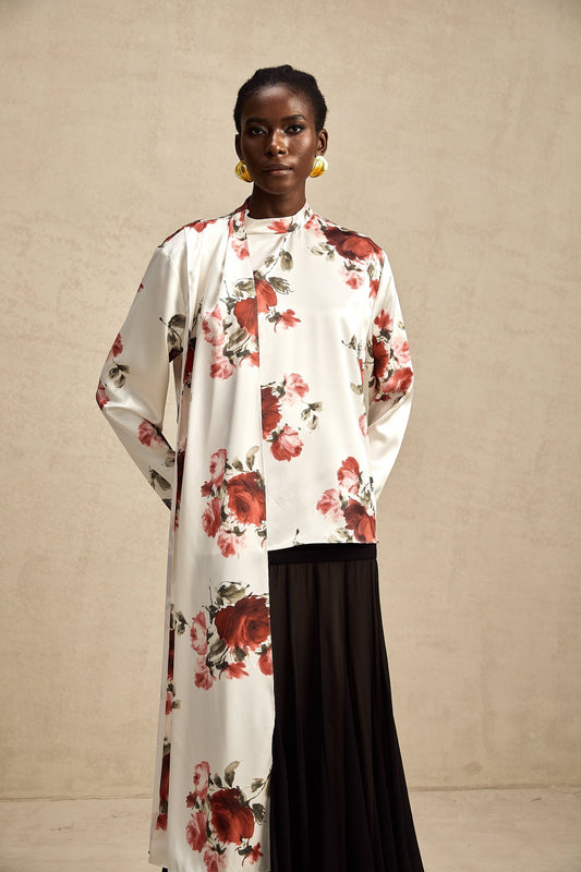 Young Black woman wearing floral print shirt and black skirt