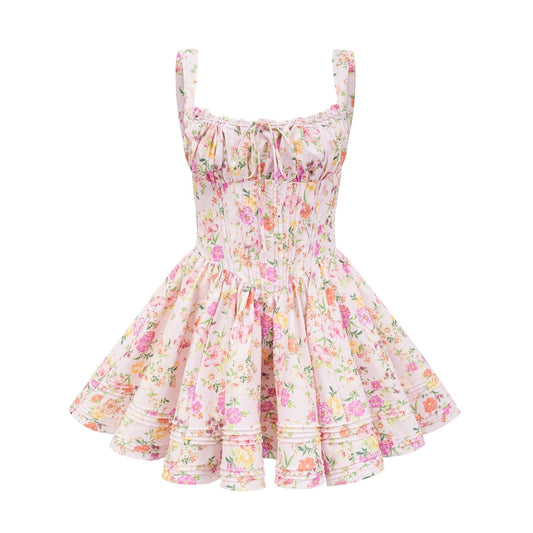 Pink sleeveless mini dress with spaghetti straps corset design floral print and pleat detailing Fastens with front tie and rear zip closure Made of 65% cotton 32% polyamide and 3% spandex