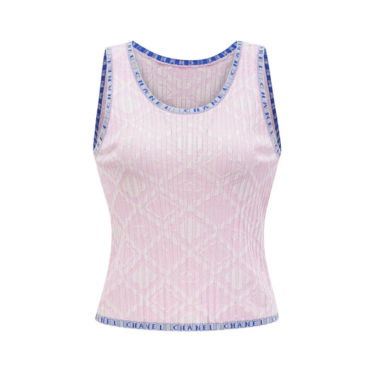 A sleeveless knitted tank top in a light color with a fitted silhouette and ribbed texture