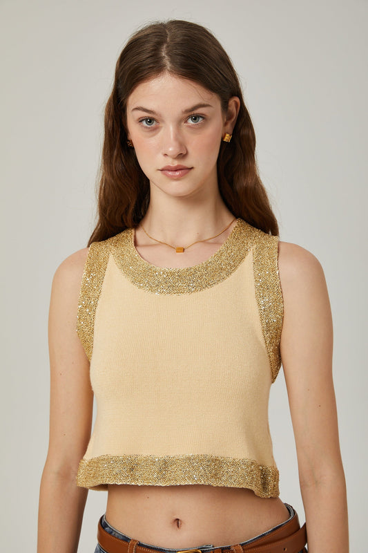 A sleeveless wool vest top with sequin embellishments featuring a feminine design