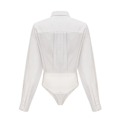 white cottonpoplin bodysuit with jersey trim and thong style bottom featuring thin straps and a snap closure