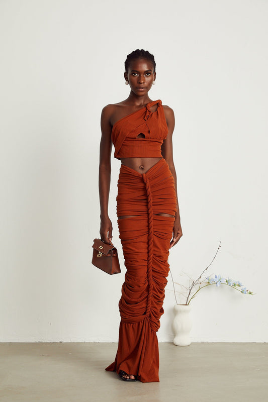 a brown matching set consisting of a twisted top with cutout details and a skirt