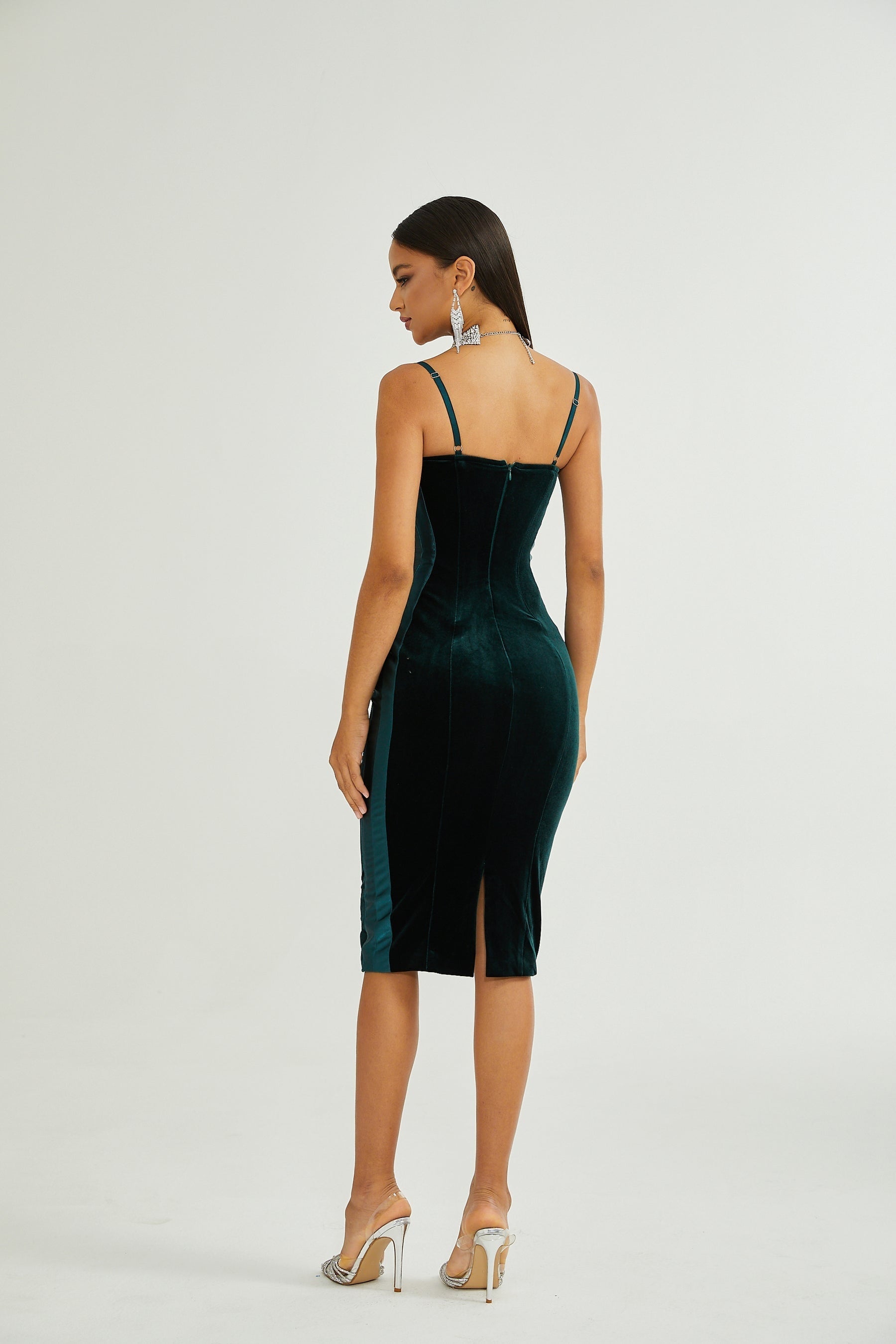 A green midi dress with a bustier top and a fitted silhouette