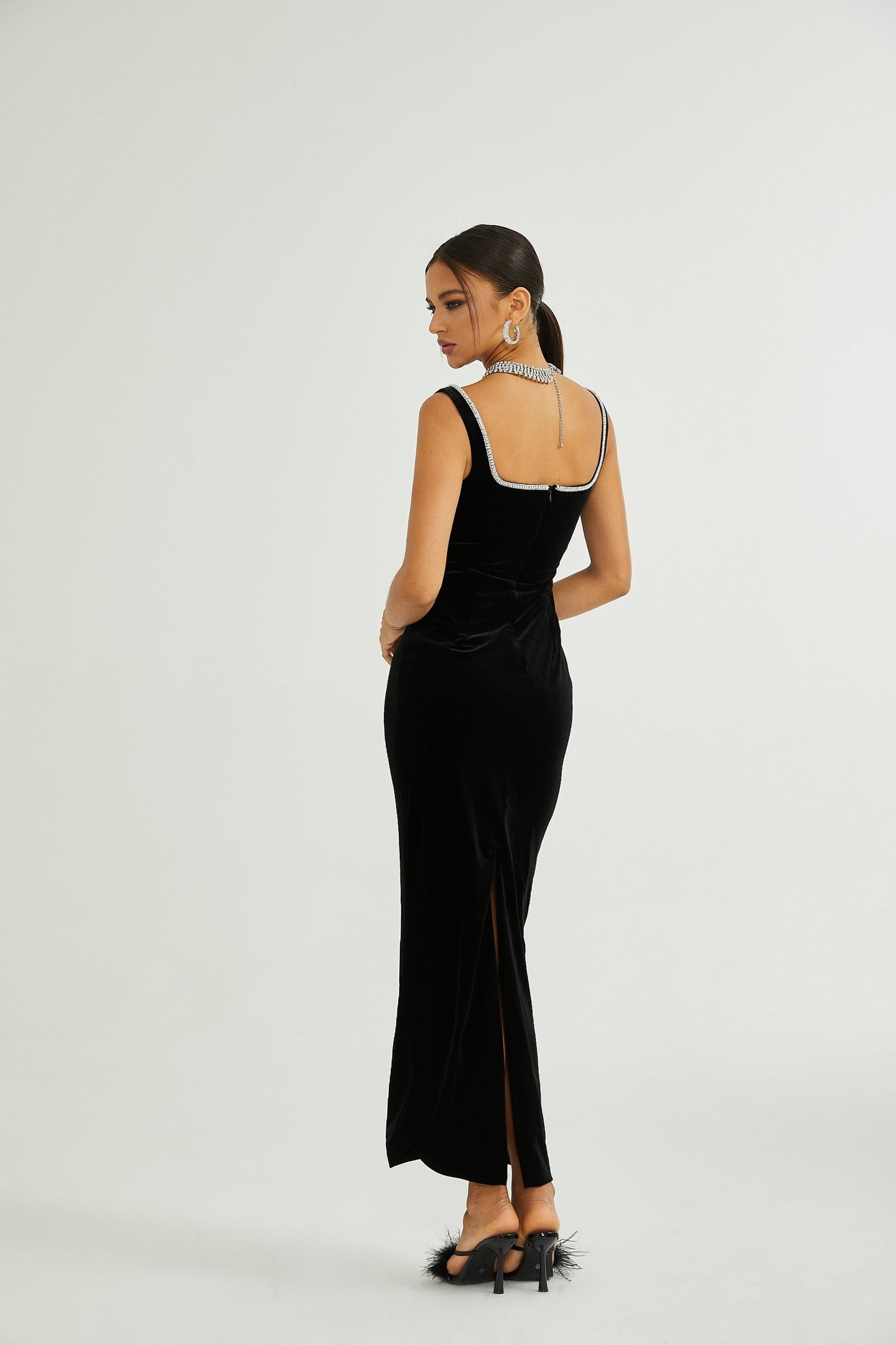 A black midi dress with a Ushaped neckline