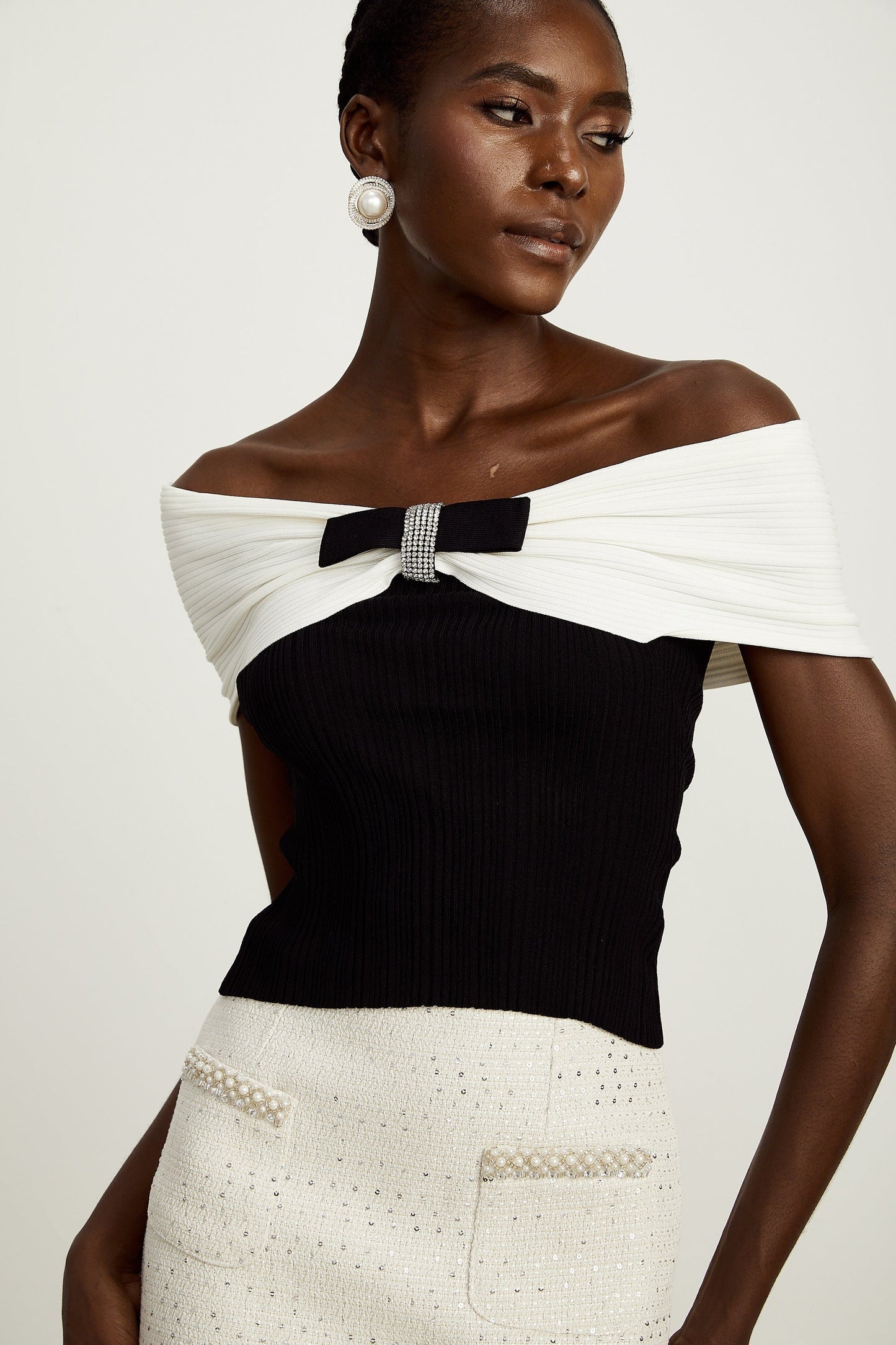 a knitted top with a bow detail