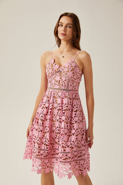 A trendy midi dress adorned with lace fabric and cut-out patterns