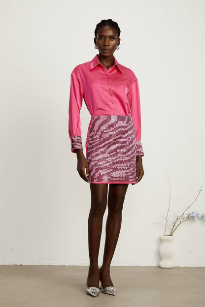 A feminine satin shirt and skirt set embellished with delicate beads