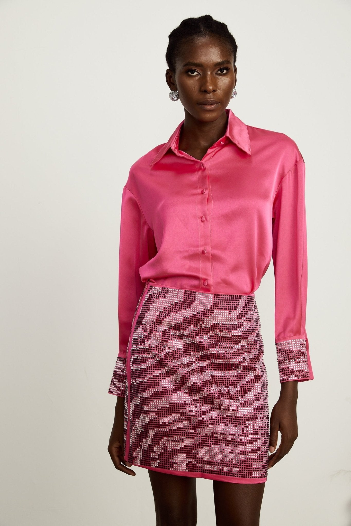 A polished satin shirt and skirt combination enhanced with beadwork