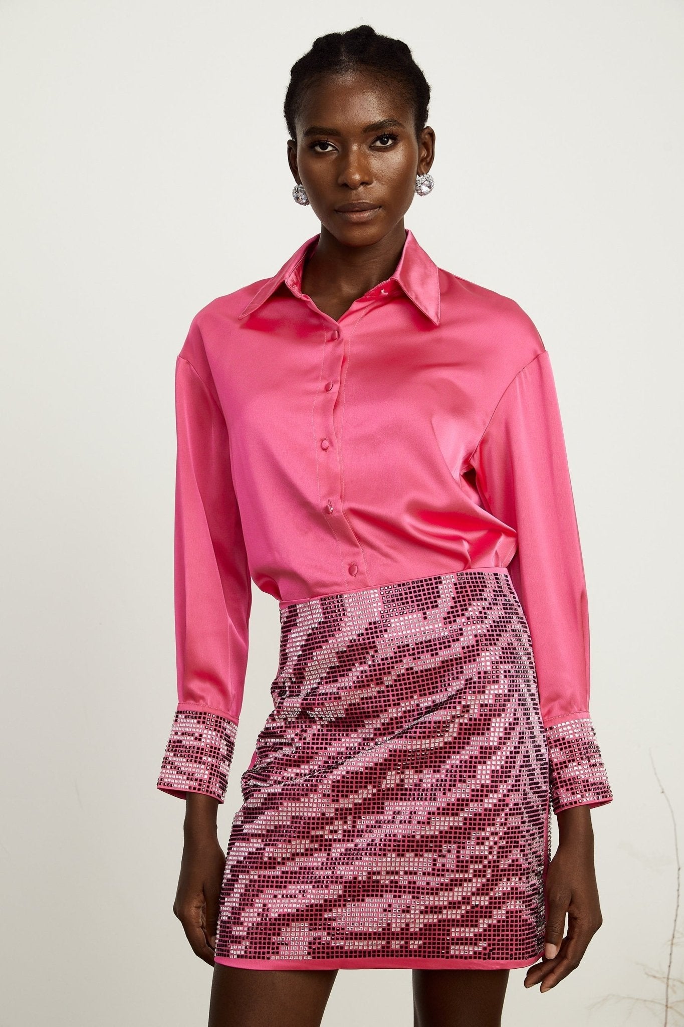 A satin finish beaded shirt and skirt matching set