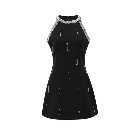 A black mini dress adorned with crystal embellishments featuring a sleek silhouette and shimmering details