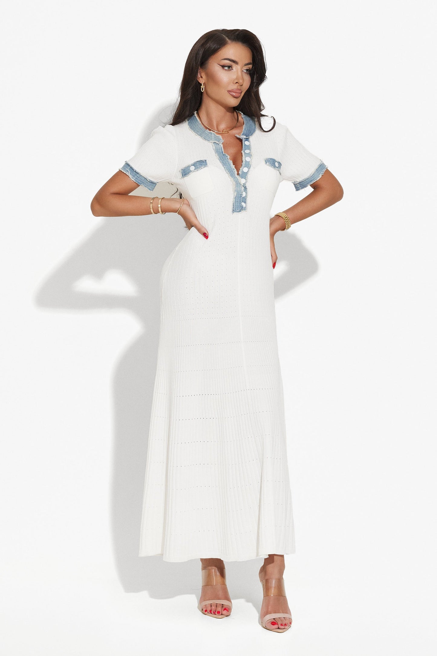 White maxi dress with short sleeves, blue denim accents, decorative chest pockets, and front button detailing