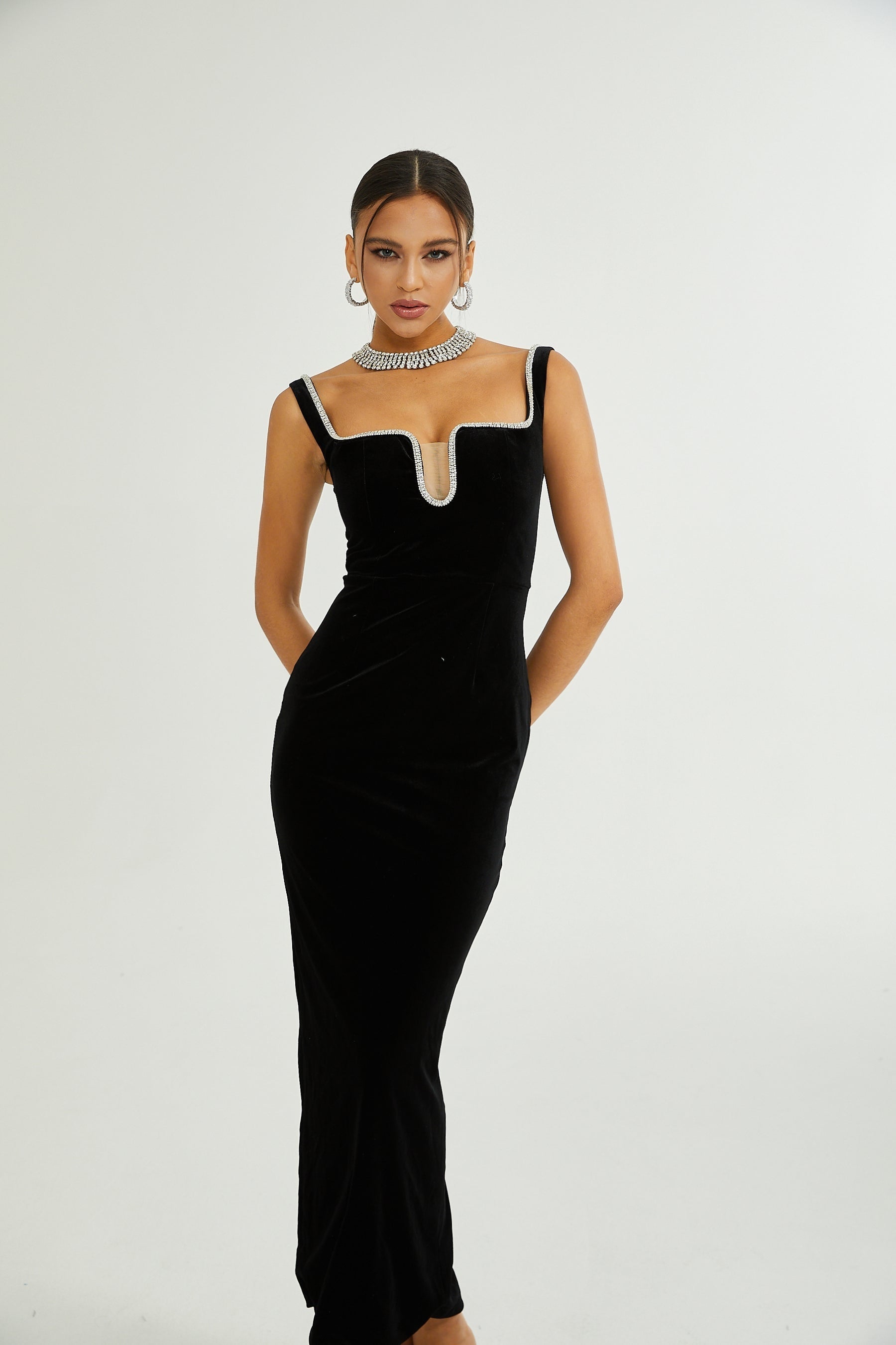 A black midi dress with a Ushaped neckline