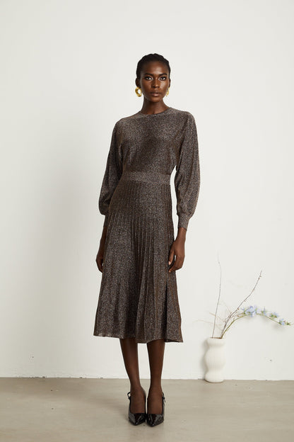 A brown ribbed midi dress with metallic threading and a fitted silhouette