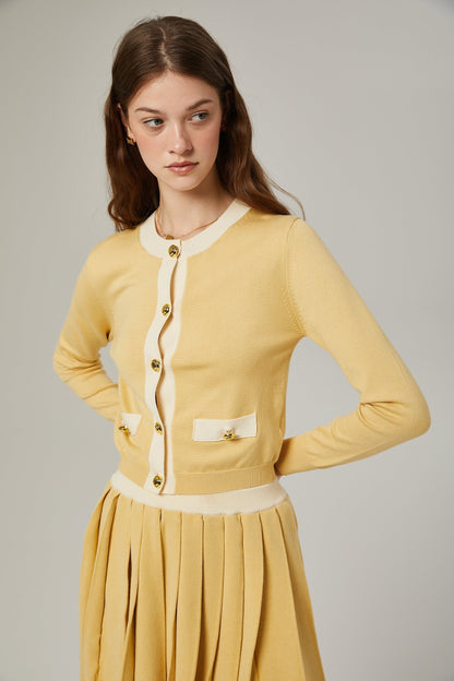 a matching wool cardigan and skirt set in a soft color