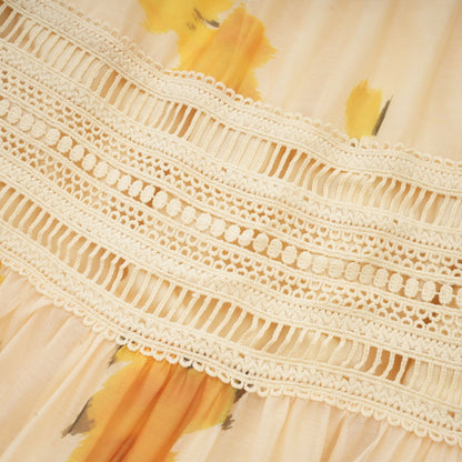 Lace trim on yellow fabric