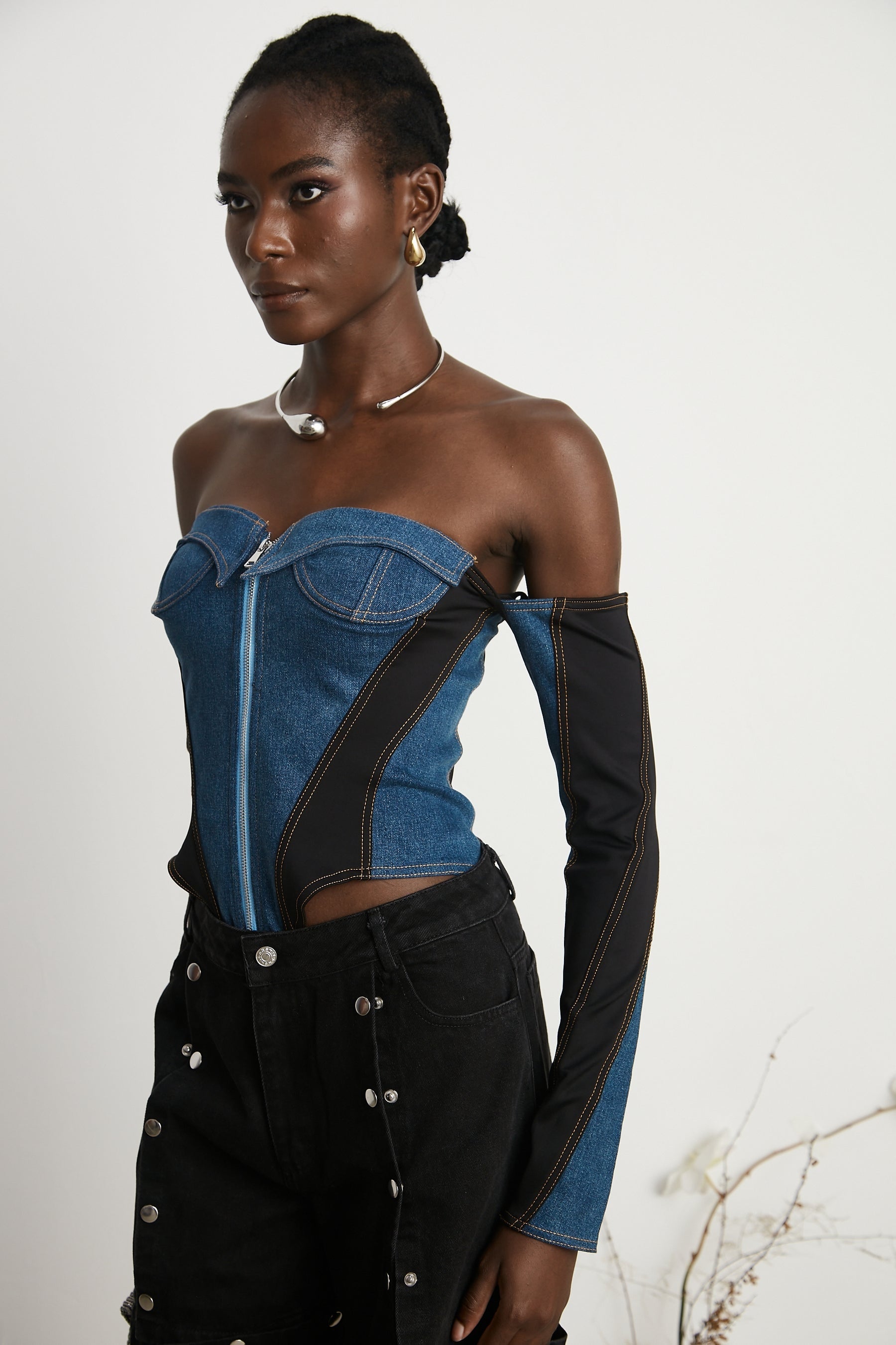 dark blue denim bodysuit with corset style top and long sleeves