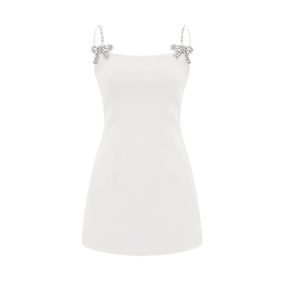 Sleeveless dress with spaghetti straps deep Vneckline crystal bow and mini length in cottonpolyester blend fabric