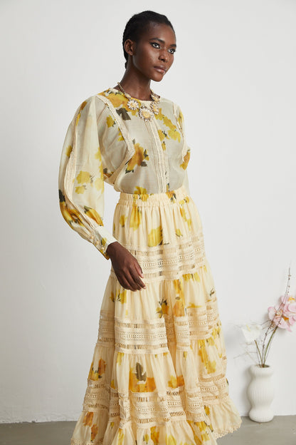 African woman wearing yellow floral print bohemian maxi dress