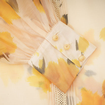 Watercolor painting of light yellow flower petals on textile background