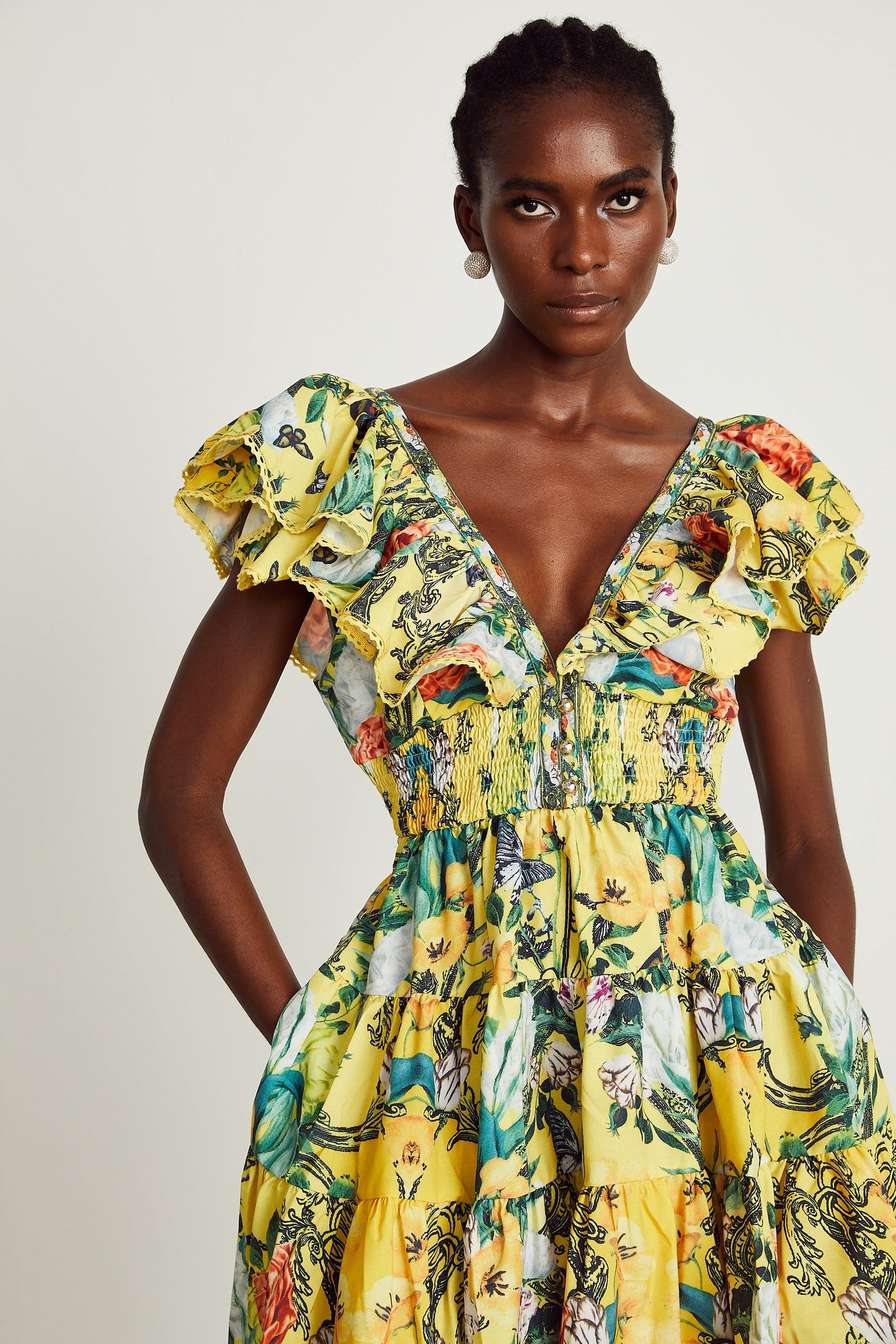 Yellow floral print mini dress with ruffled details and short length